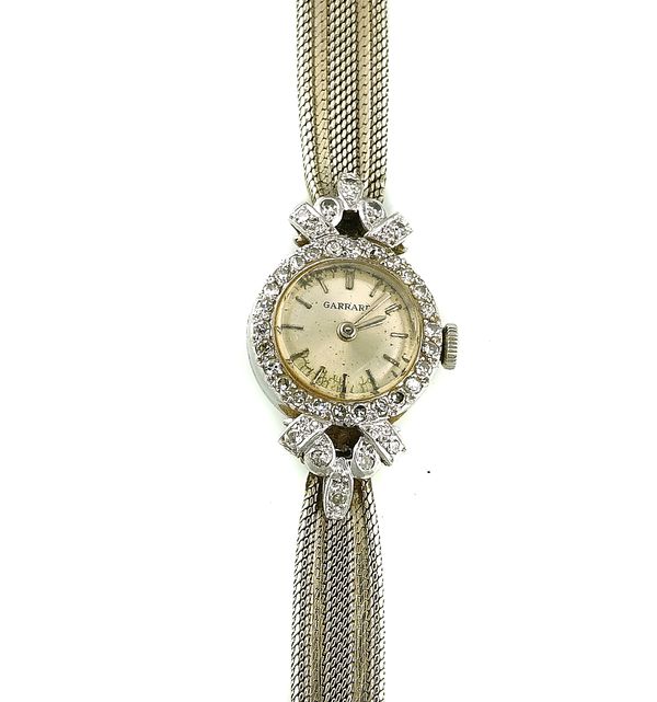 A GARRARD 9CT WHITE GOLD AND DIAMOND SET LADY'S DRESS WRISTWATCH