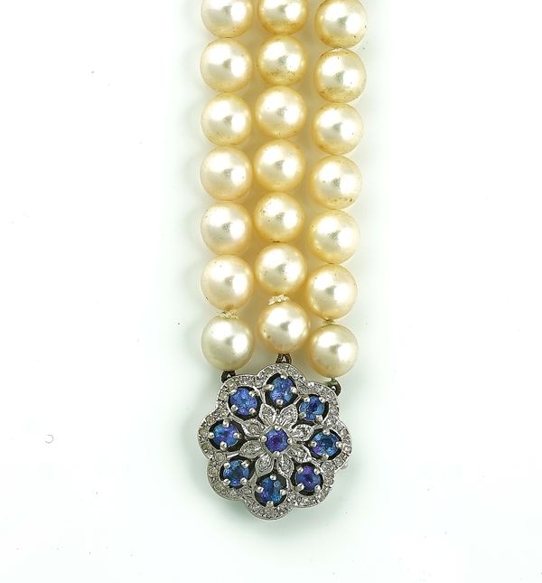 A THREE ROW NECKLACE OF UNIFORM CULTURED PEARLS