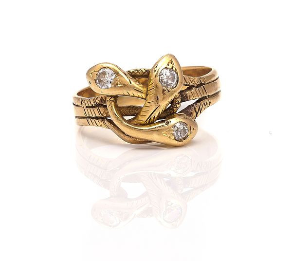 A GOLD AND DIAMOND TRIPLE HEAD SNAKE RING