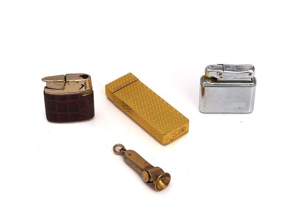 A CARTIER GILT METAL RECTANGULAR GAS LIGHTER