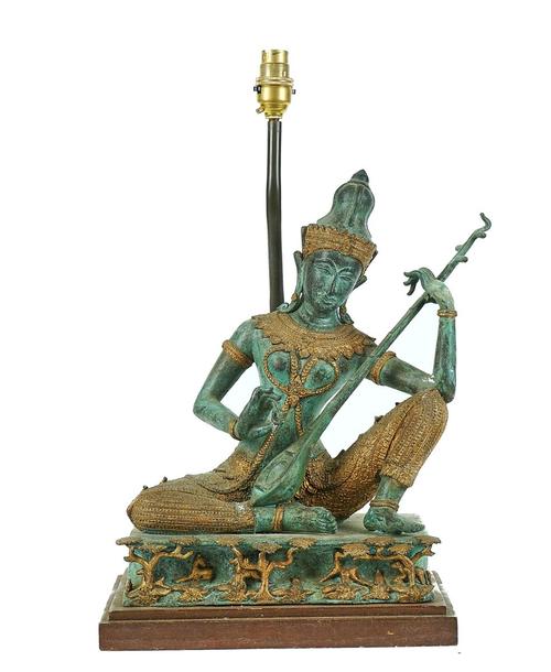 A PATINATED & GILT BRONZE MODEL OF A THAI MUSICIAN