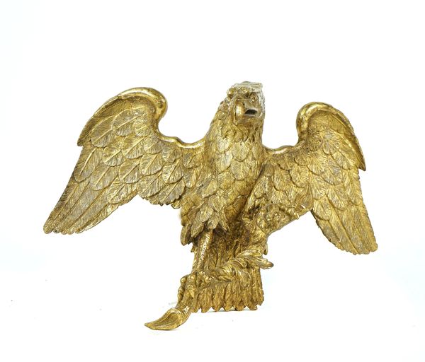A CARVED GILT-WOOD MODEL OF AN EAGLE