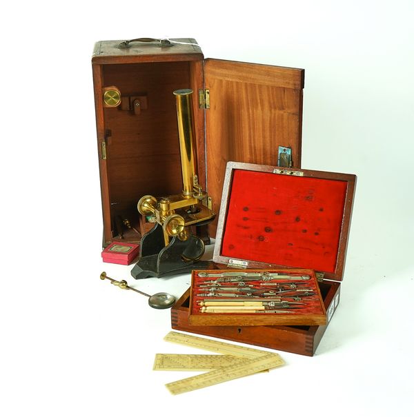 A VICTORIAN MAHOGANY CASED OPTICIAN’S DRAUGHTSMAN SET AND A STUDENTS MICROSCOPE (2)