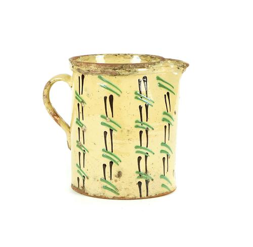A FRENCH YELLOW OCHRE SLIP GLAZED JUG