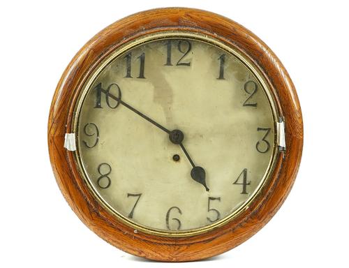 AN OAK MOUNTED WALL CLOCK