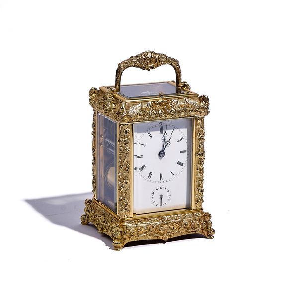 A FRENCH RELIEF-CAST BRASS PETITE SONNERIE STRIKING CARRIAGE CLOCK