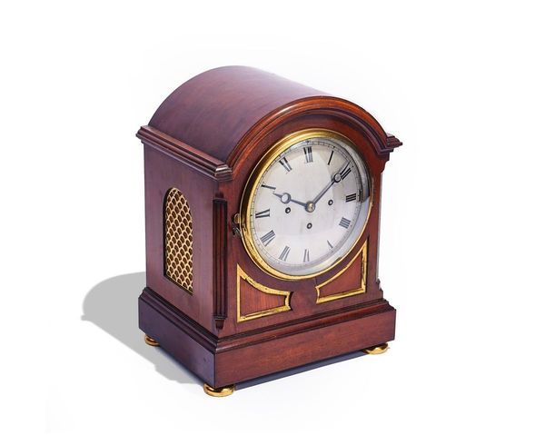 AN EDWARDIAN MAHOGANY QUARTER-CHIMING MANTEL CLOCK