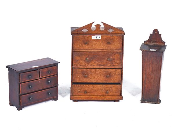 A 19TH CENTURY OAK MINIATURE CHEST OF FOUR DRAWERS  (3)