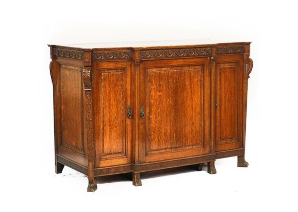 AN 18TH CENTURY STYLE OAK BREAKFRONT SIDE CABINET