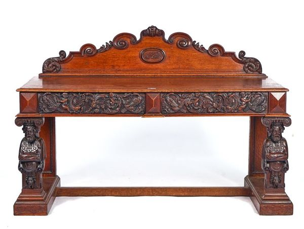 A VICTORIAN CARVED OAK SERVING TABLE