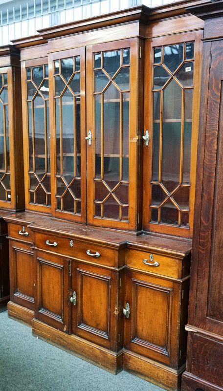 A MAHOGANY BREAKFRONT BOOKCASE CABINET
