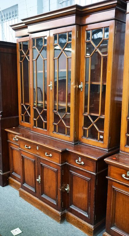 A MAHOGANY BREAKFRONT BOOKCASE CABINET