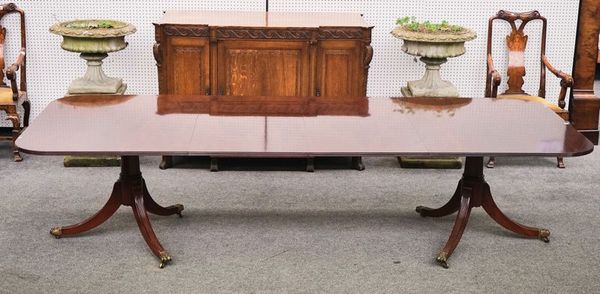 PROBABLY BRIGHTS OF NETTLEBED; A REGENCY STYLE MAHOGANY EXTENDING DINING TABLE