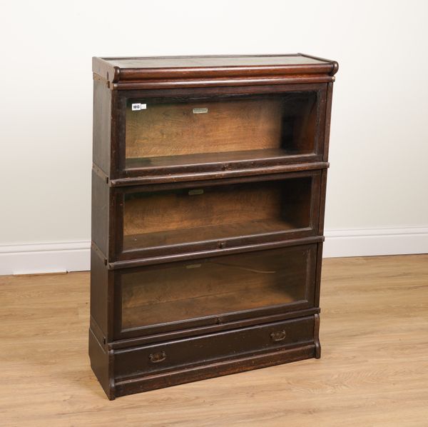 GLOBE WERNICKE; AN OAK THREE SECTION BOOKCASE