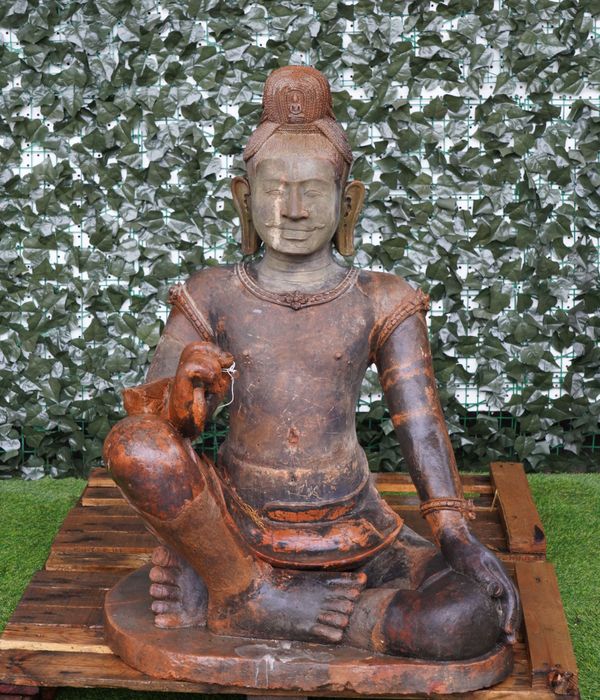 A TERRACOTTA FIGURE OF A SEATED BUDDHA