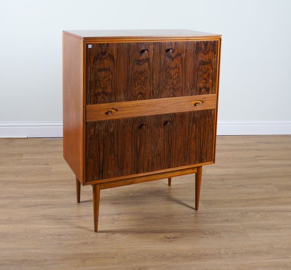 ROBERT HERITAGE FOR ARCHIE SHINE; A 20TH CENTURY TEAK AND ROSEWOOD COCKTAIL CABINET