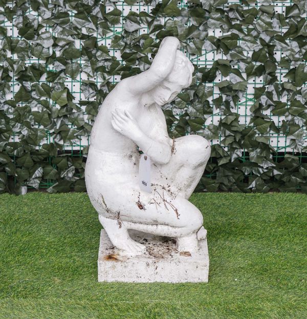 A WHITE PAINTED CAST-IRON  FIGURE OF A KNEELING NUDE