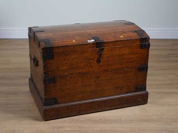 AN EARLY 20TH CENTURY IRON-BOUND OAK DOME TOP TRUNK