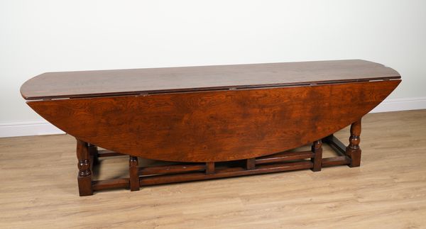 A LARGE 17TH CENTURY STYLE OAK DOUBLE GATE LEG DROP FLAP TABLE