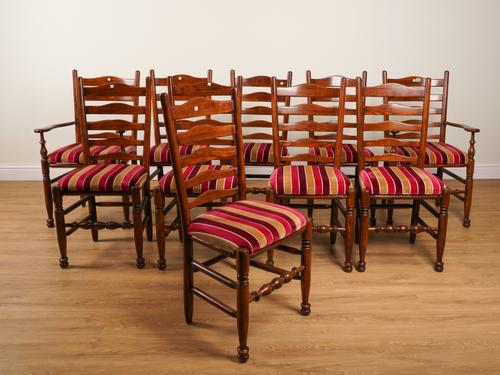 A SET OF TEN 18TH CENTURY STYLE ASH AND OAK LADDER BACK DINING CHAIRS (10)