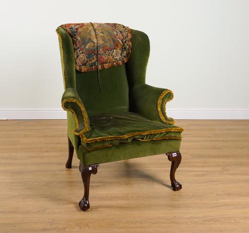 A GEORGE II STYLE WINGBACK ARMCHAIR