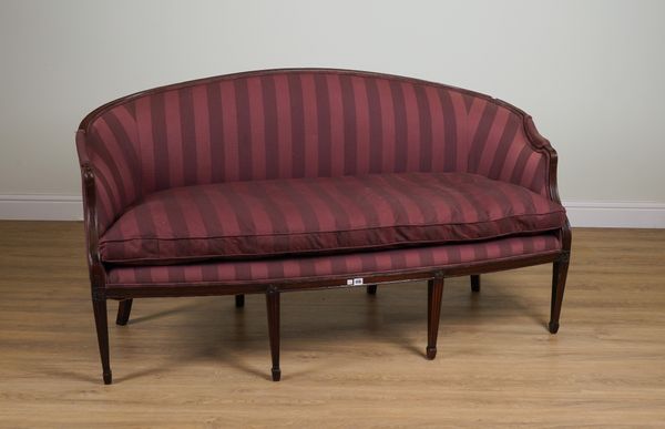 A GEORGE III STYLE MAHOGANY ARCH BACK SOFA