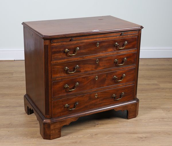 A GEORGE II STYLE MAHOGANY FOUR DRAWER CHEST WITH BRUSHING SLIDE