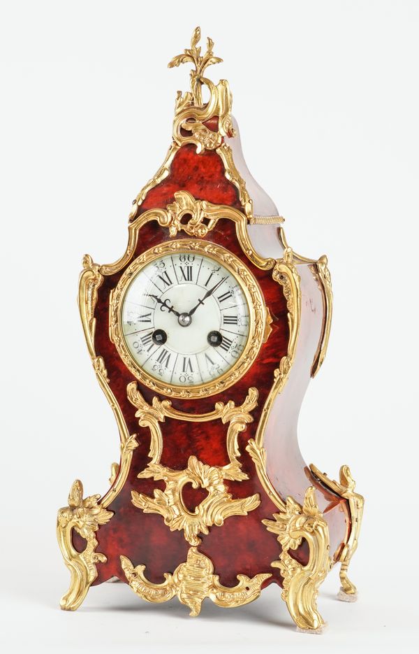 A FRENCH GILT-METAL-MOUNTED TORTOISESHELL MANTEL CLOCK