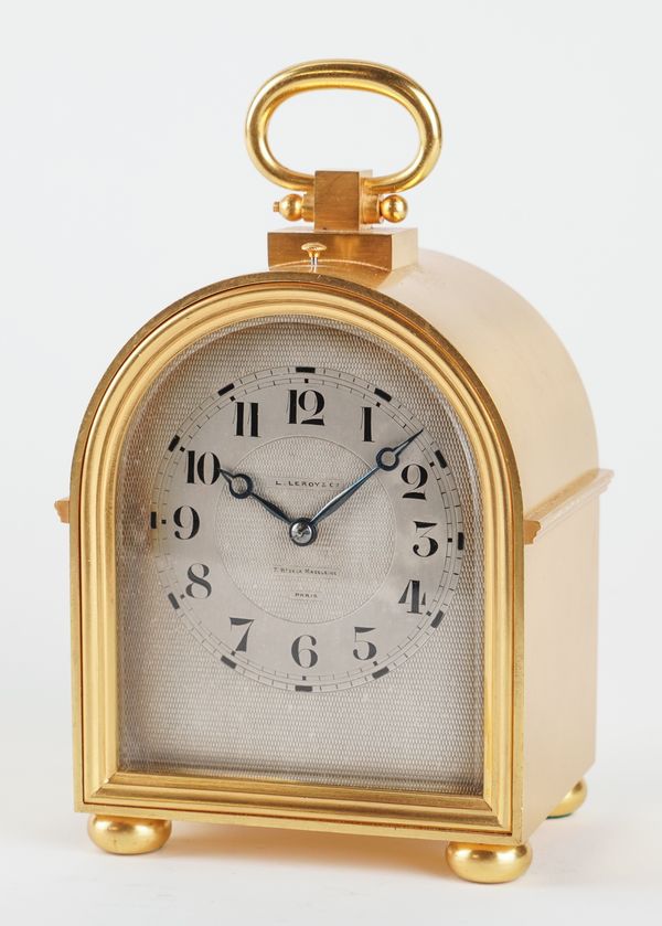 A FRENCH GILT-BRASS HUMP-BACK MANTEL CLOCK WITH PUSH REPEAT AND ALARM