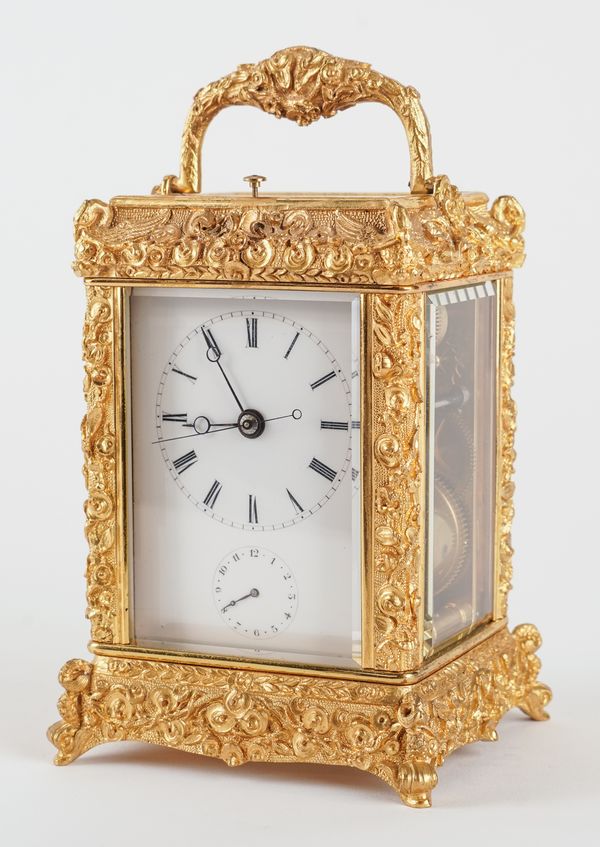 A RARE AND UNUSUAL GILT CAST-BRASS CARRIAGE CLOCK WITH PUSH REPEAT AND ALARM FOR THE CHINESE MARKET