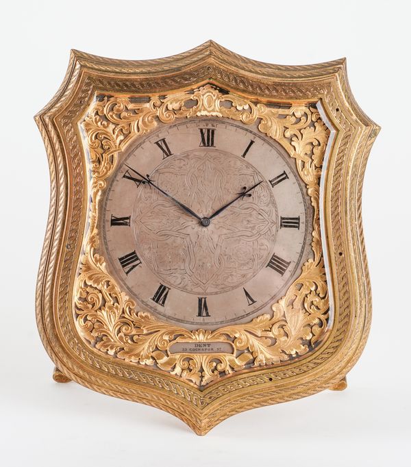 A GOOD VICTORIAN GILT-BRASS AND ENGRAVED SHIELD-SHAPED STRUT TIMEPIECE