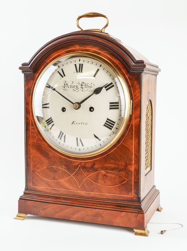 A LATE GEORGE III BRASS-MOUNTED MAHOGANY AND LINE-INLAID STRIKING BRACKET CLOCK