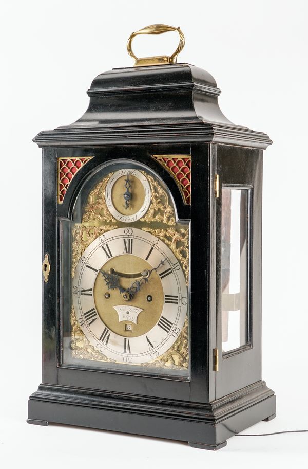 A GEORGE III BRASS-MOUNTED EBONISED STRIKING VERGE TABLE CLOCK