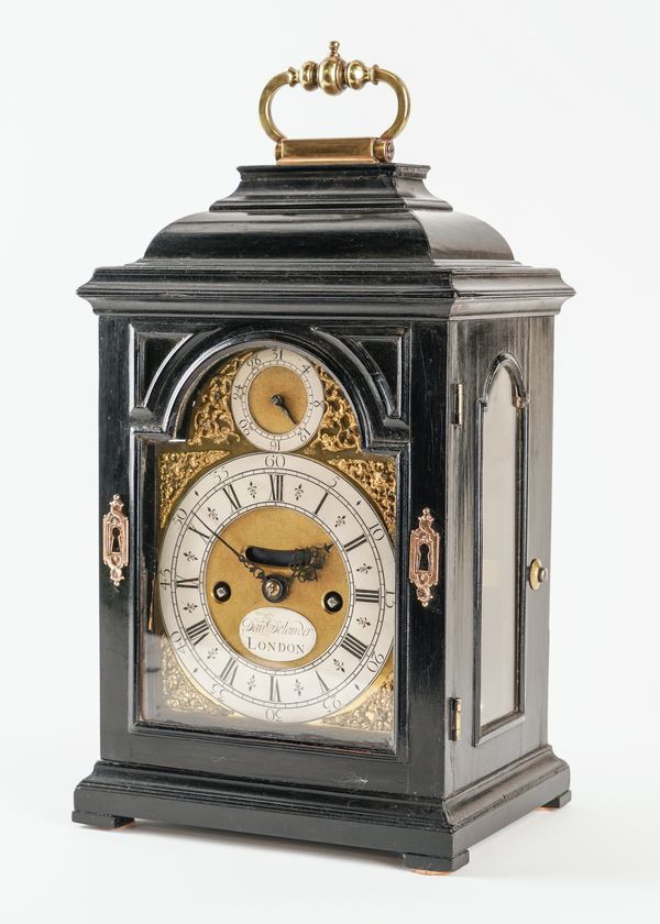 A GEORGE I EBONISED SMALL STRIKING TABLE CLOCK