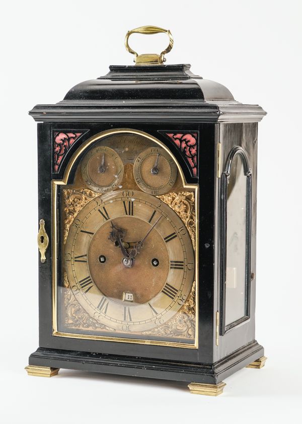 A GEORGE III BRASS-MOUNTED EBONISED STRIKING TABLE CLOCK