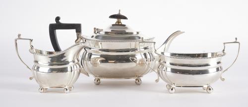 A SILVER THREE PIECE TEA SET