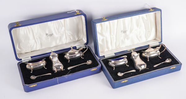 TWO SIMILAR SILVER THREE-PIECE CRUET SETS (2)