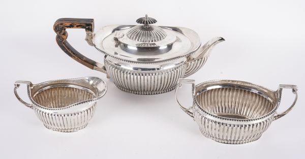 A LATE VICTORIAN SILVER THREE PIECE TEA SET