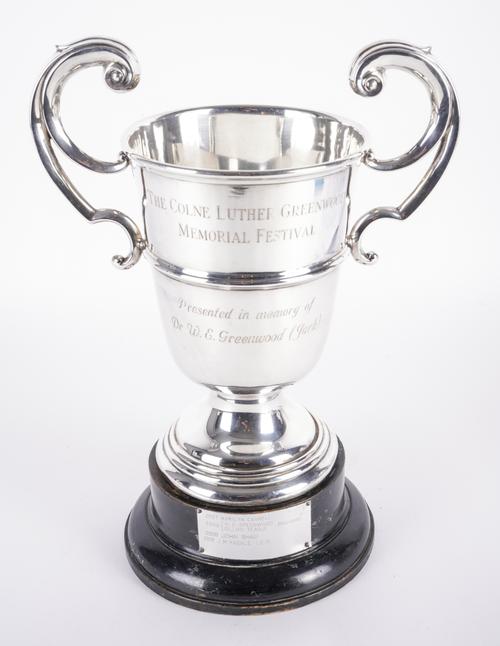 A SILVER TWIN HANDLED TROPHY CUP