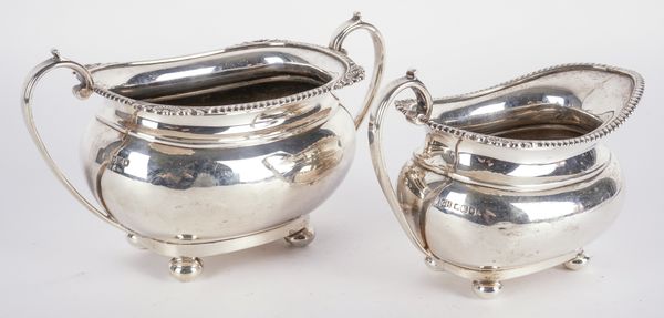 A SILVER TWIN HANDLED SUGAR BOWL WITH A MATCHING MILK JUG (2)