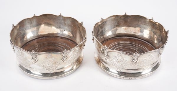 A PAIR OF EARLY VICTORIAN SILVER MOUNTED BOTTLE COASTERS (2)