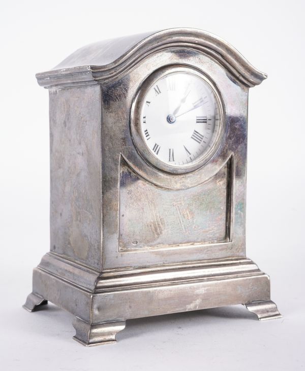 A SILVER CASED MANTEL CLOCK