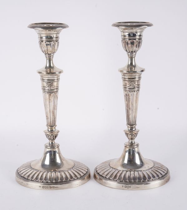 A PAIR OF SILVER TABLE CANDLESTICKS