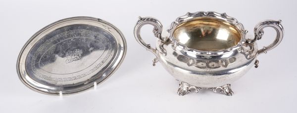 A SILVER TWIN HANDLED SUGAR BOWL AND A SILVER OVAL TEAPOT STAND (2)