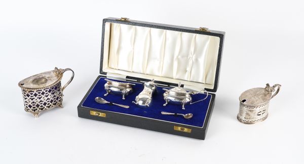 A THREE PIECE SILVER CONDIMENT SET AND TWO SILVER MUSTARD POTS (3)