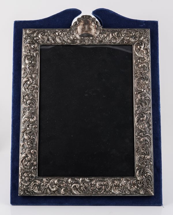 A SHAPED RECTANGULAR PHOTOGRAPH FRAME