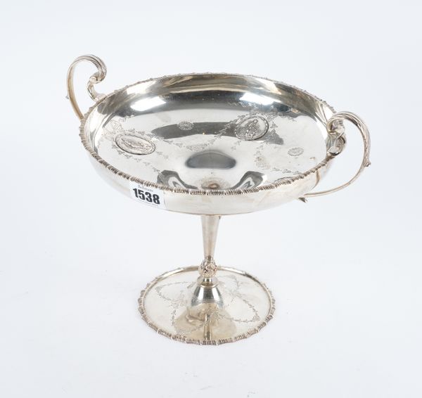 A SILVER TWIN HANDLED PEDESTAL BOWL