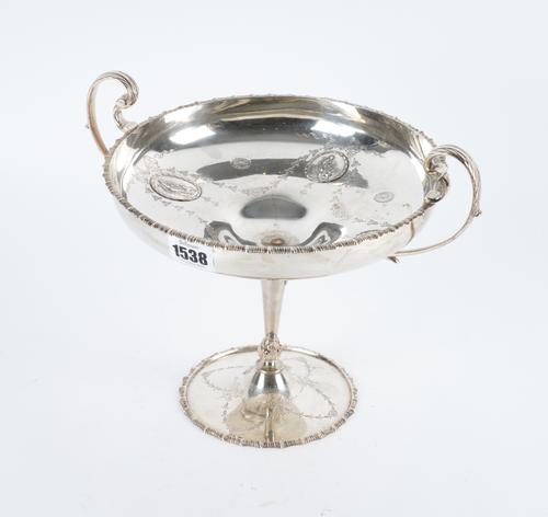 A SILVER TWIN HANDLED PEDESTAL BOWL