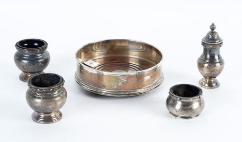 A SILVER MOUNTED BOTTLE COASTER AND FOUR SILVER CONDIMENTS (5)