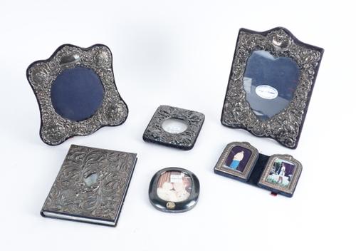 FIVE SILVER MOUNTED PHOTOGRAPH FRAMES AND A SILVER MOUNTED ADDRESS BOOK (6)